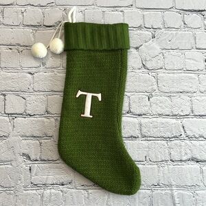 Green Christmas stocking, letter “T”